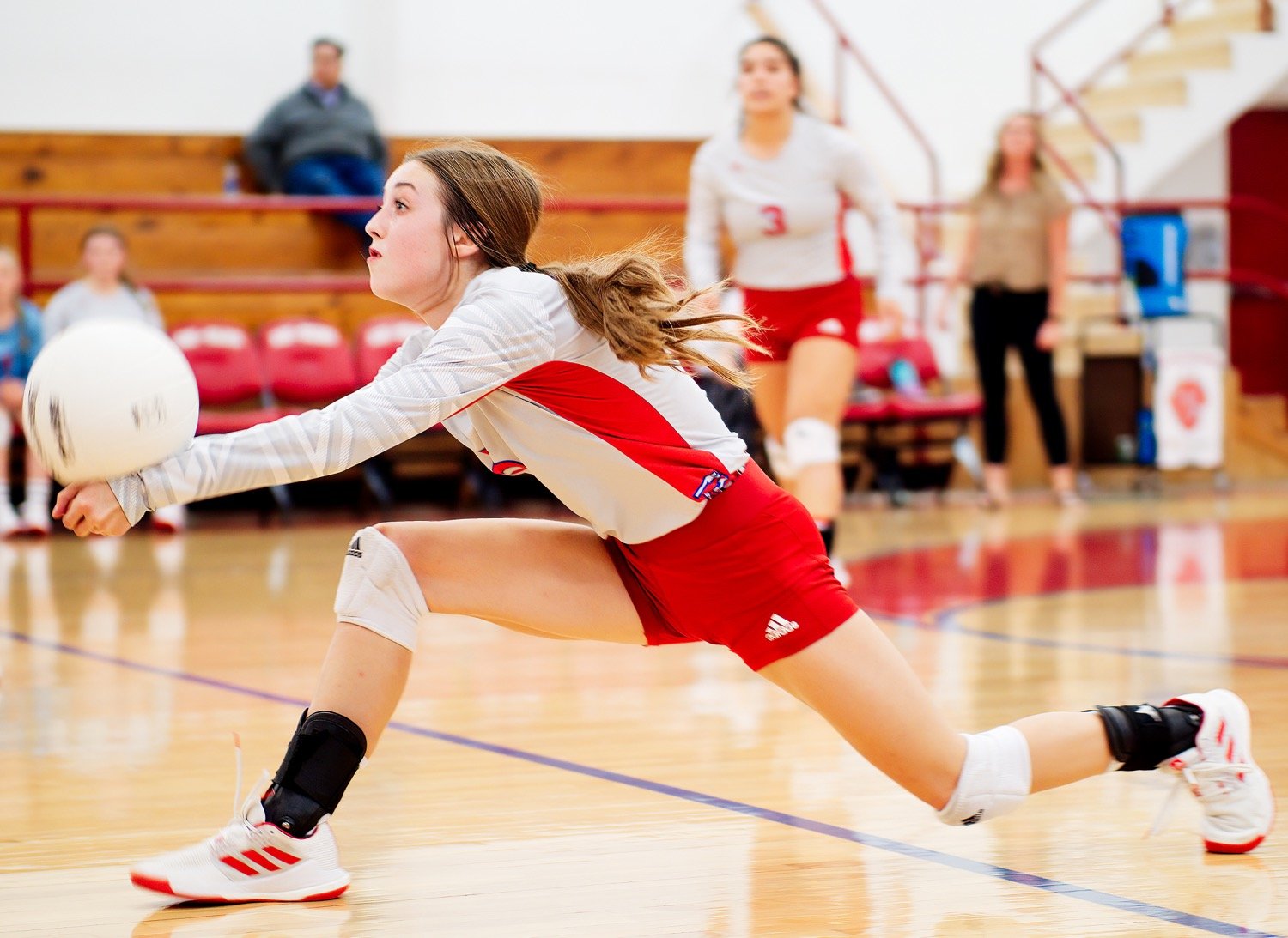 Kamrin Wright lunges forward for a dig at home Sept. 28 against Como-Pickton. [more from that match] Wright was named to second team all-district and earned academic all-district honors.
